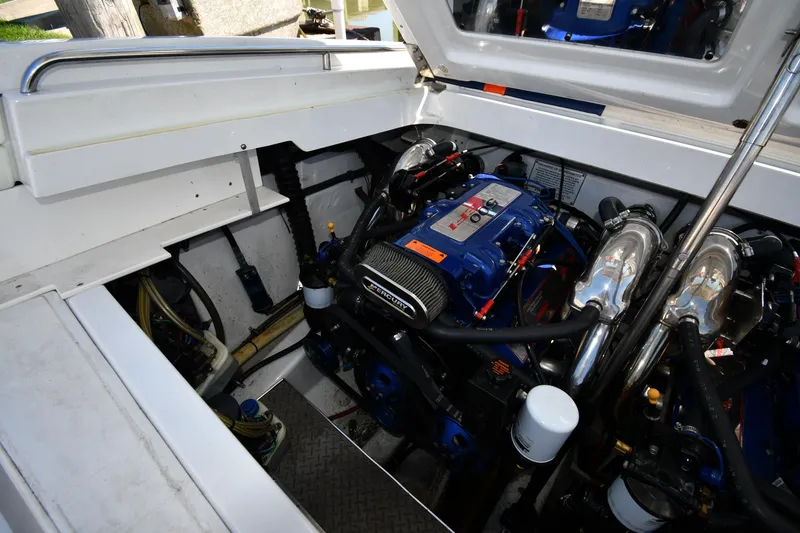 Slide: The Image of 2003 Formula 353 FASTech engine compartment with high-performance components and clean layout. - 48