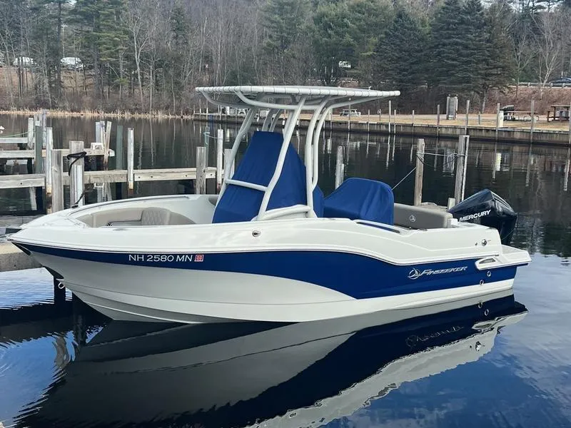 Slide: The Image of 2021 Finseeker 200 CC boat docked on calm water. - 1