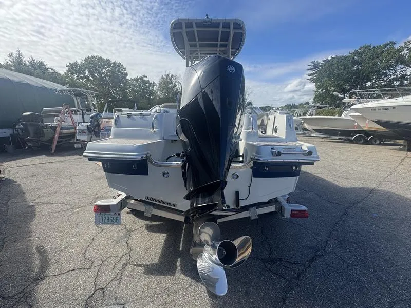 Slide: The Image of 2021 Finseeker 200 CC boat with powerful outboard motor, parked on a trailer. - 11