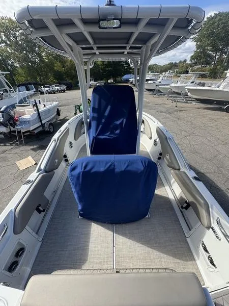 Slide: The Image of 2021 Finseeker 200 CC boat with blue seat covers, docked in a marina. - 14