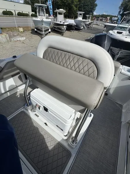 Slide: The Image of 2021 Finseeker 200 CC boat interior with cushioned seating and storage. - 17