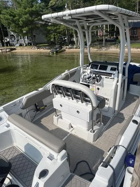 Slide: The Image of 2021 Finseeker 200 CC boat with seating and console, docked by a lake. - 23