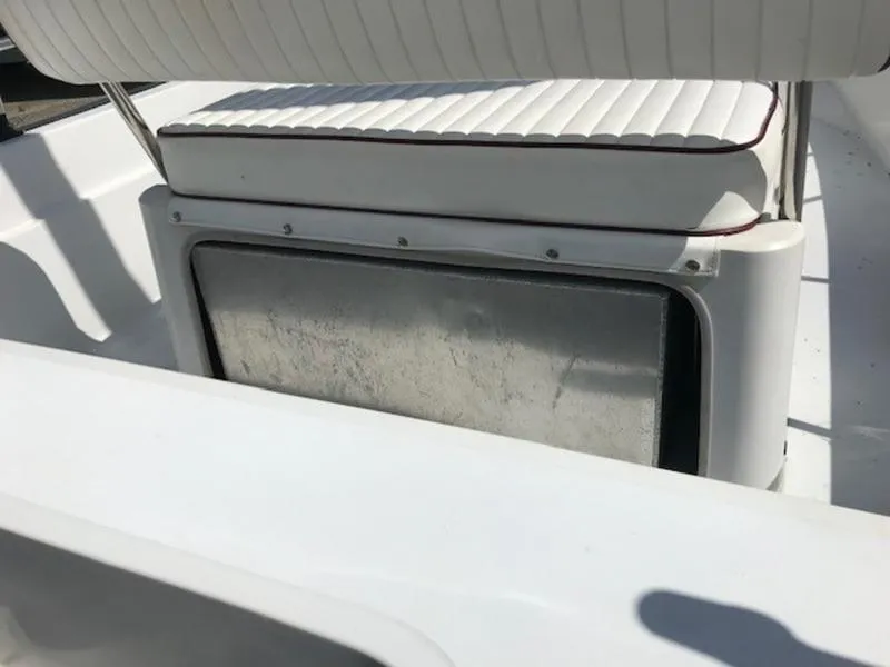 Slide: The Image of 1995 Boston Whaler 150 Dauntless boat seat and storage compartment. - 11