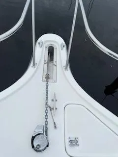 Slide: The Image of Bow of 2000 Pursuit 3400 Express boat with anchor chain and railing. - 11