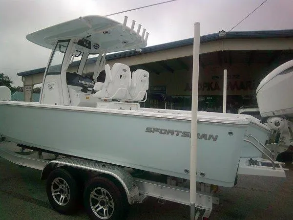 Slide: The Image of 2025 Sportsman 267 Masters boat on trailer, parked outdoors. - 10