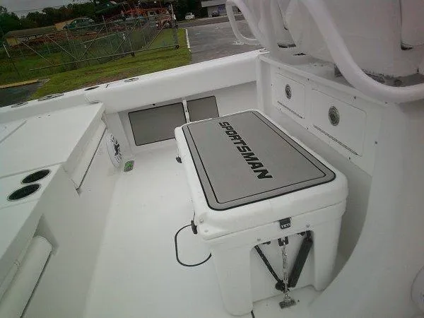 Slide: The Image of 2025 Sportsman 267 Masters boat interior with storage and seating area. - 3