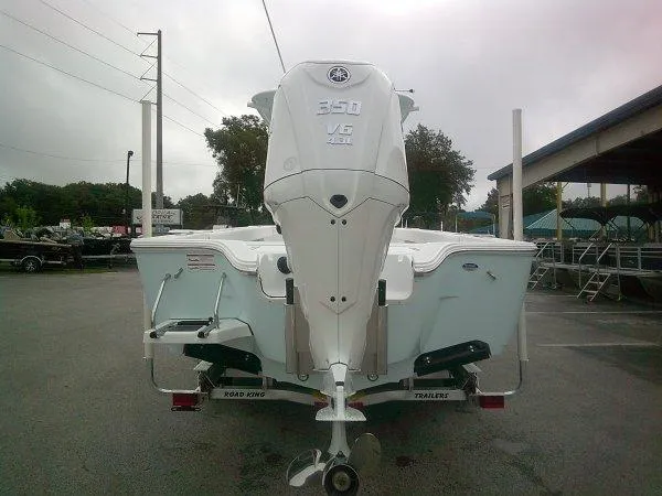 Slide: The Image of 2025 Sportsman 267 Masters boat with powerful 350 V8 engine, parked outdoors. - 7