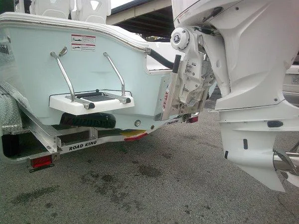 Slide: The Image of 2025 Sportsman 267 Masters boat on Road King trailer, rear view. - 8
