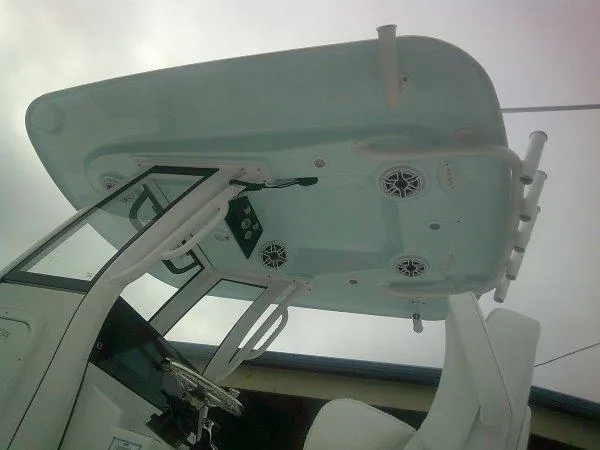Slide: The Image of 2025 Sportsman 267 Masters boat console with speakers and rod holders. - 9