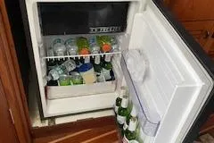 Slide: The Image of Fridge on Pursuit 3400 Express boat, stocked with drinks. - 22