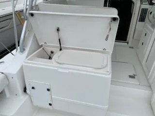 Slide: The Image of Open storage compartment on a 2000 Pursuit 3400 Express boat. - 5