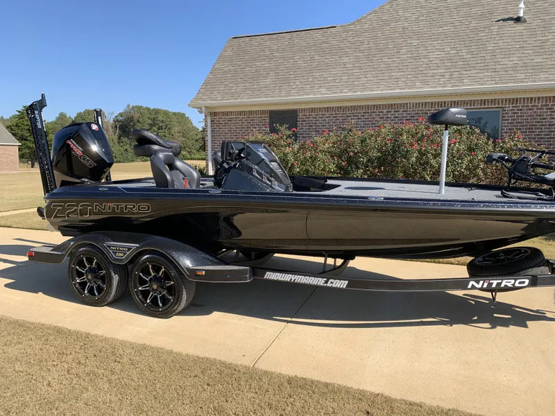 Slide: The Image of 2023 Nitro Z20 Pro boat on trailer, parked in driveway. - 3