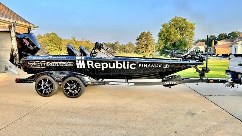 Slide: The Image of 2023 Nitro Z20 Pro boat with Republic Finance branding on a driveway. - 4