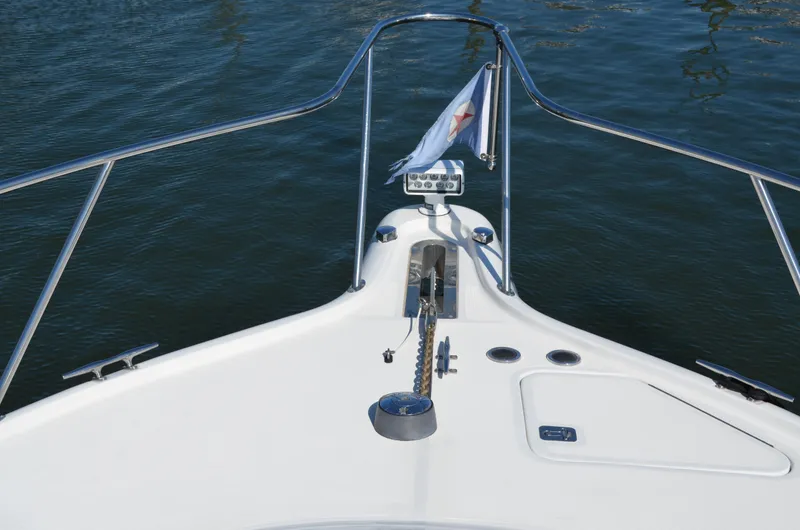 Slide: The Image of Bow view of 2004 Tiara Yachts 3800 Open on calm water. - 15