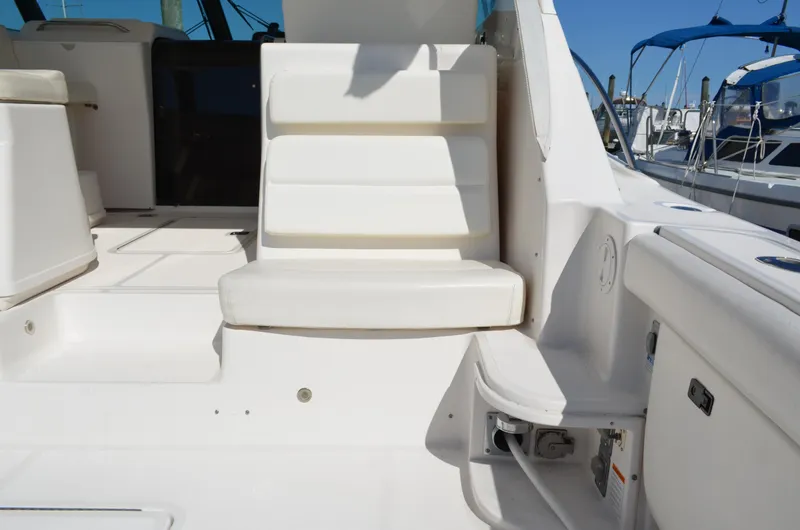 Slide: The Image of 2004 Tiara Yachts 3800 Open interior seating area with white upholstery. - 17
