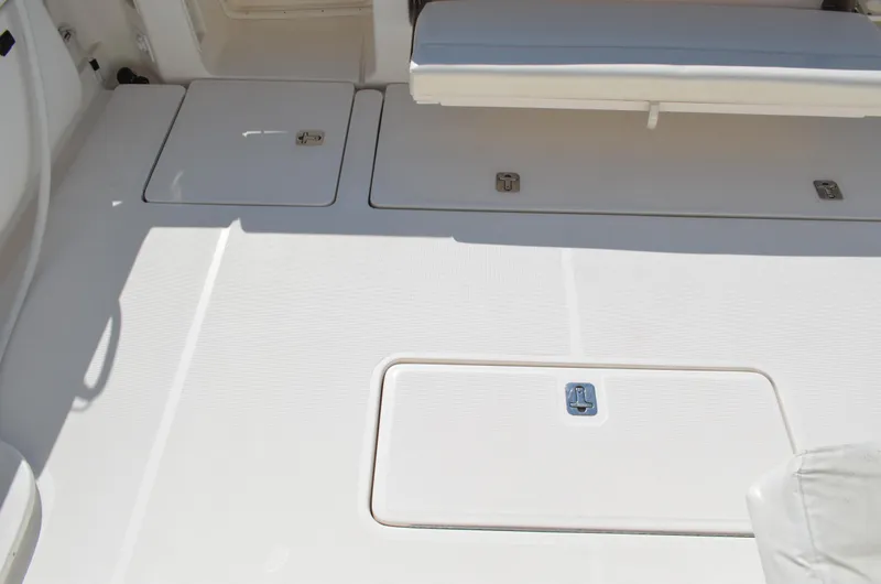 Slide: The Image of 2004 Tiara Yachts 3800 Open deck with storage compartments and seating. - 24