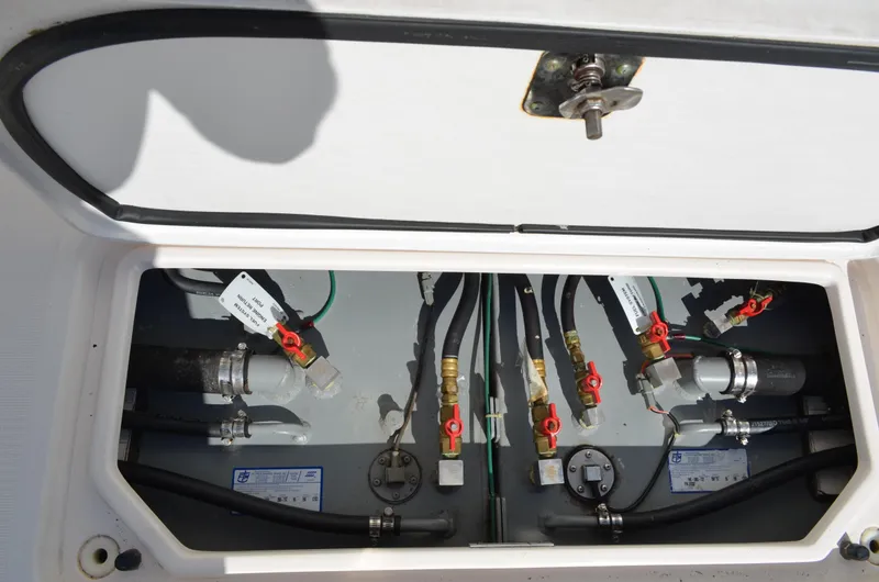Slide: The Image of 2004 Tiara Yachts 3800 Open engine compartment with valves and hoses. - 25