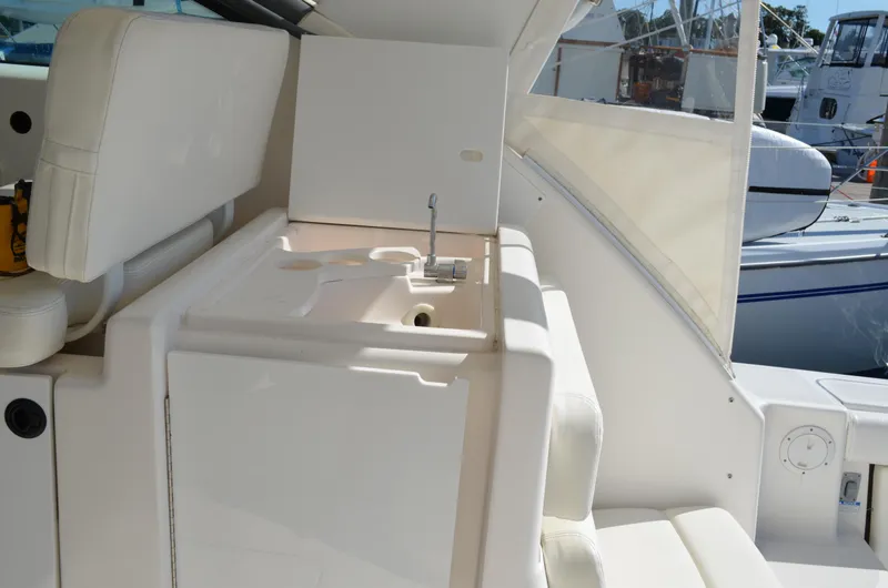 Slide: The Image of 2004 Tiara Yachts 3800 Open interior with sink and seating area. - 27