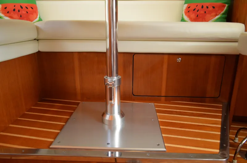 Slide: The Image of Tiara Yachts 3800 Open 2004 interior with wood flooring and watermelon-themed cushions. - 41