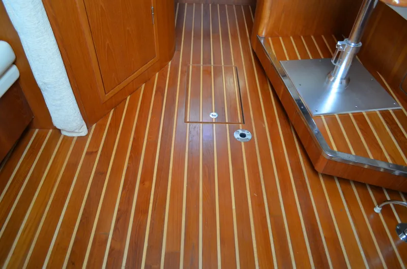 Slide: The Image of 2004 Tiara Yachts 3800 Open interior with polished wooden flooring. - 43
