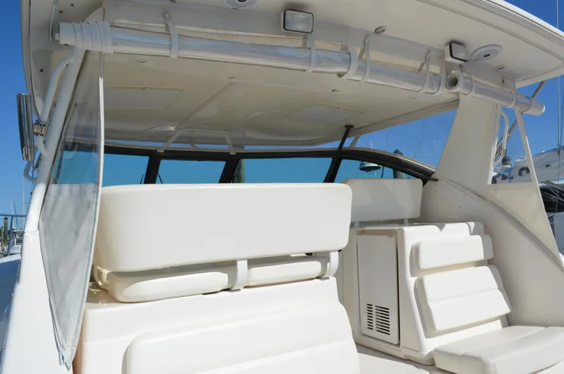 Slide: The Image of 2004 Tiara Yachts 3800 Open interior with white seating and modern design. - 9