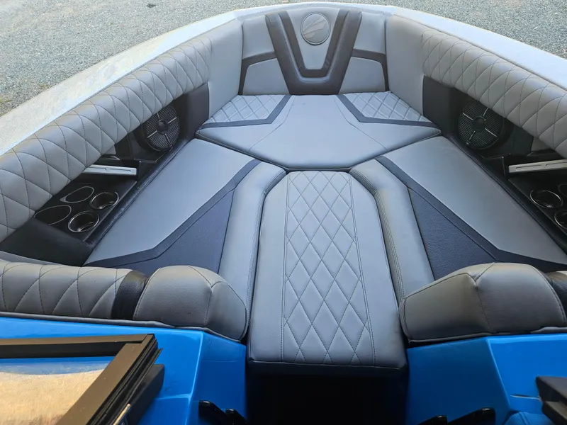 Slide: The Image of Luxurious interior of 2020 Tigé 25ZX boat with quilted seating and cup holders. - 35