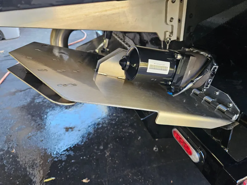 Slide: The Image of Close-up of 2020 Tigé 25ZX boat's trim tab mechanism. - 45