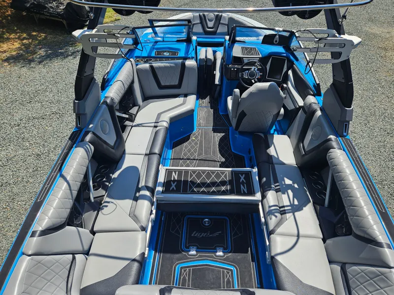 Slide: The Image of Interior of 2020 Tigé 25ZX boat with luxurious seating and modern dashboard. - 47