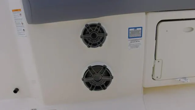Slide: The Image of 2025 Boston Whaler 280 Outrage boat speakers and storage compartment. - 10