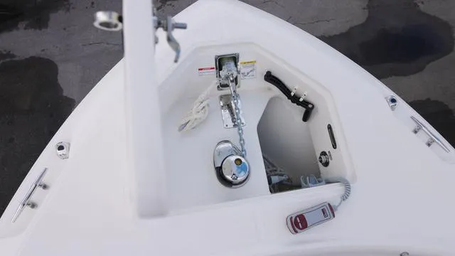 Slide: The Image of Anchor compartment of 2025 Boston Whaler 280 Outrage boat, featuring chain and storage. - 20