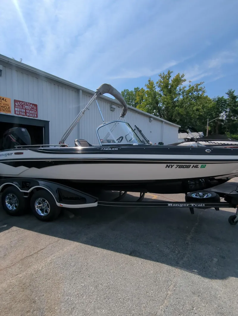 The Image of 2023 Ranger 2080MS boat on trailer, parked outside a building. - 0