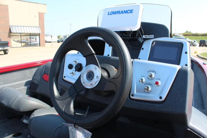 Slide: The Image of 2025 Tracker Pro Team 175 Crappie Edition boat dashboard with Lowrance electronics. - 13