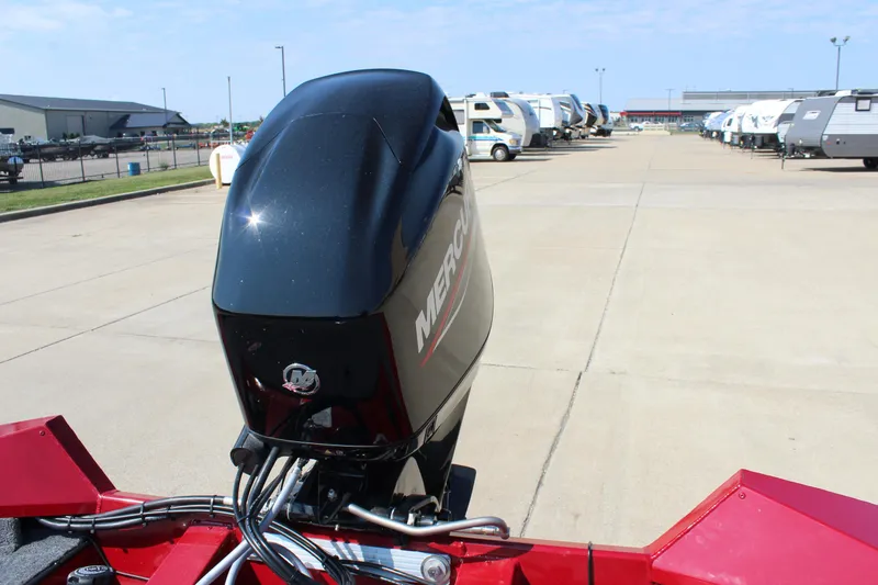 Slide: The Image of 2025 Tracker Pro Team 175 Crappie Edition with Mercury outboard motor in a parking lot. - 19