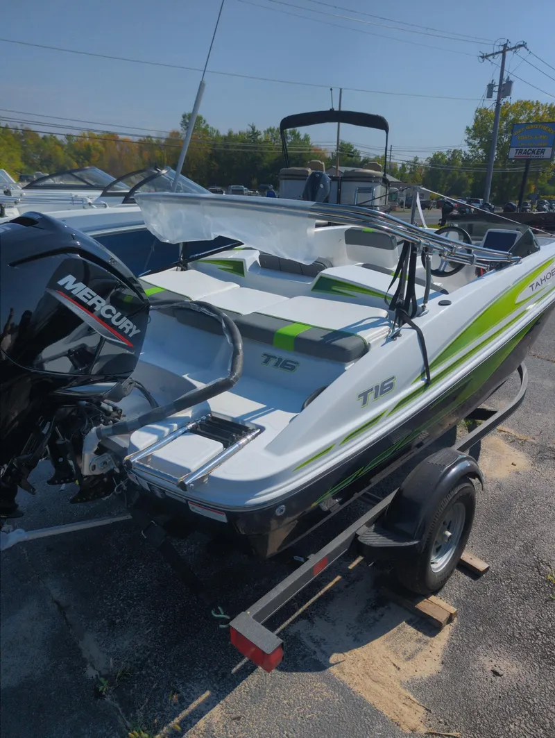 Slide: The Image of 2024 Tahoe T16 boat with Mercury engine on trailer, outdoor display. - 3