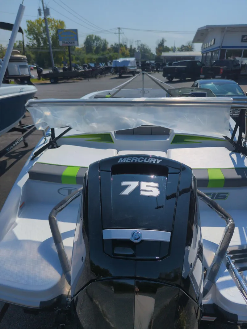 Slide: The Image of 2024 Tahoe T16 boat with Mercury 75 engine in a dealership lot. - 4