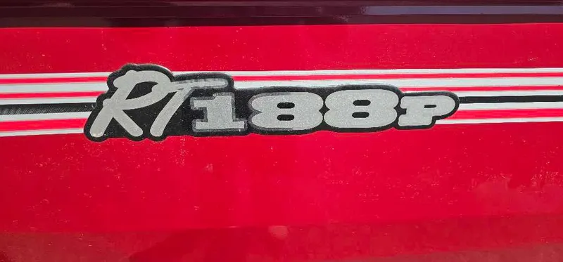 Slide: The Image of Red 2024 Ranger RT188P boat logo with white stripes. - 2