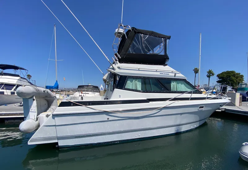 Slide: The Image of 1988 Chris-Craft 320 Amerosport Sedan boat docked in marina. - 1