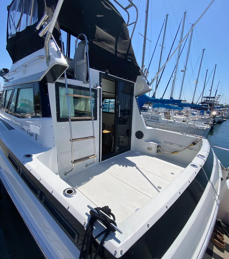 Slide: The Image of 1988 Chris-Craft 320 Amerosport Sedan docked at marina, rear view. - 13