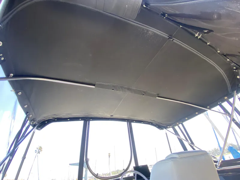 Slide: The Image of 1988 Chris-Craft 320 Amerosport Sedan boat canopy interior view. - 24