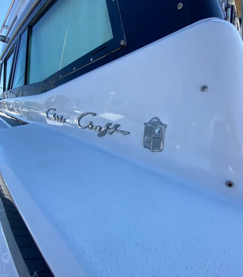 Slide: The Image of 1988 Chris-Craft 320 Amerosport Sedan boat, close-up of logo and emblem. - 28