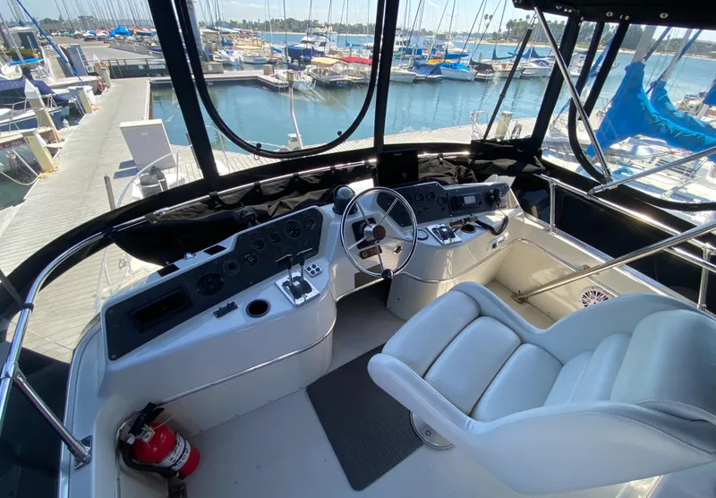 Slide: The Image of Interior helm of 1988 Chris-Craft 320 Amerosport Sedan at marina. - 30