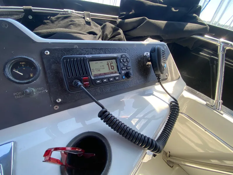 Slide: The Image of 1988 Chris-Craft 320 Amerosport Sedan dashboard with radio and controls. - 33