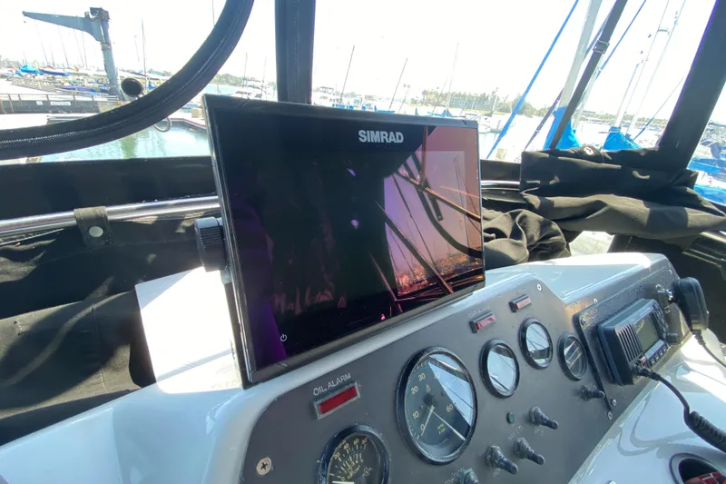 Slide: The Image of Dashboard of 1988 Chris-Craft 320 Amerosport Sedan with Simrad navigation system. - 34
