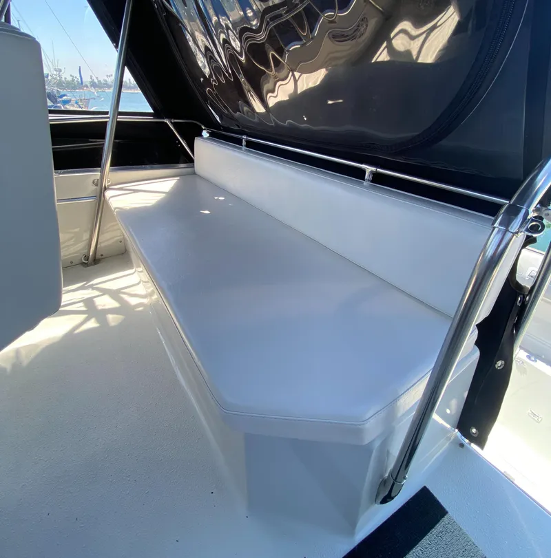 Slide: The Image of 1988 Chris-Craft 320 Amerosport Sedan interior with white seating and sleek design. - 36