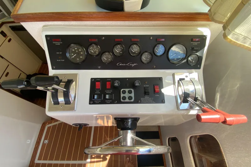 Slide: The Image of Control panel of 1988 Chris-Craft 320 Amerosport Sedan boat with gauges and levers. - 44