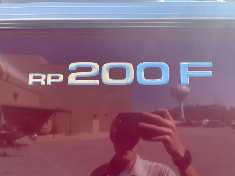 Slide: The Image of 2024 Ranger Reata 200F logo on reflective surface. - 2