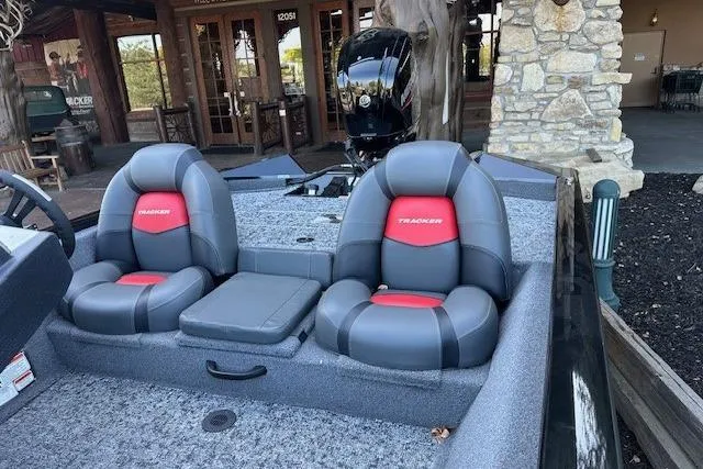 Slide: The Image of 2025 Tracker Pro Team 175 boat interior with dual gray and red seats. - 3