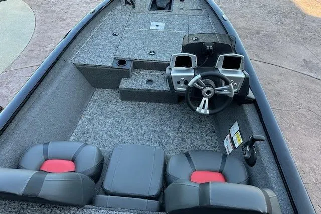 Slide: The Image of 2025 Tracker Pro Team 175 boat interior with dual seats and steering console. - 4