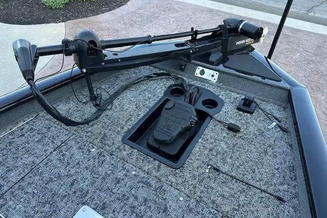 Slide: The Image of 2025 Tracker Pro Team 175 boat deck with trolling motor and pedal controls. - 6