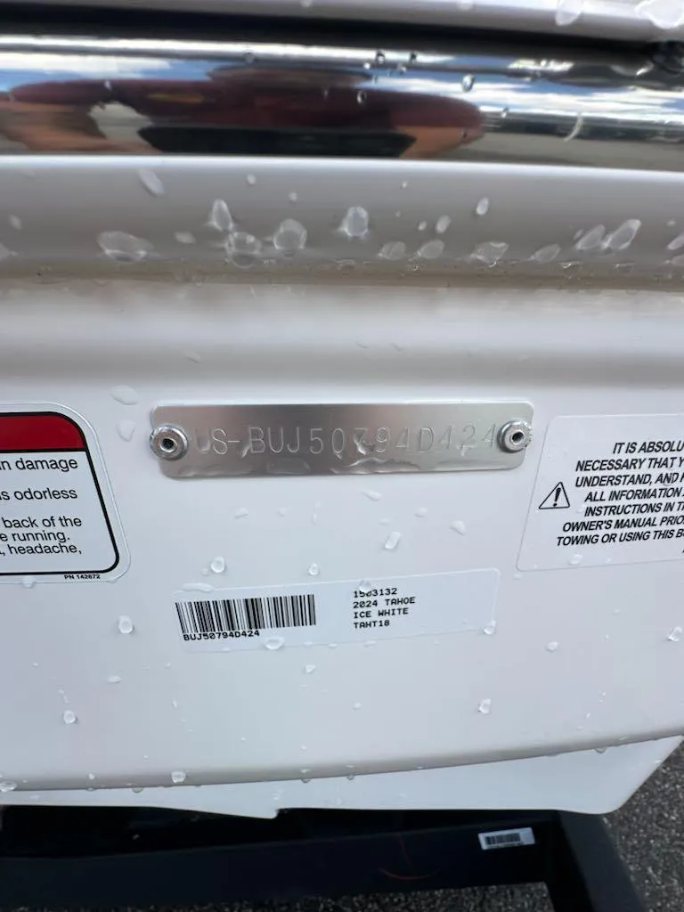 Slide: The Image of 2024 Tahoe T18 boat with identification plate and safety labels. - 4